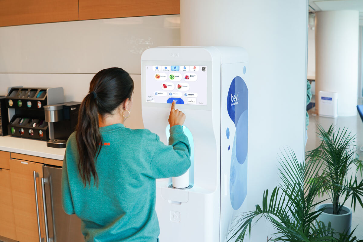Bevi smart water dispenser with touchscreen in an office kitchen