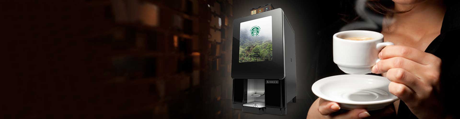 starbucks automatic coffee machine and a lady enjoying espresso