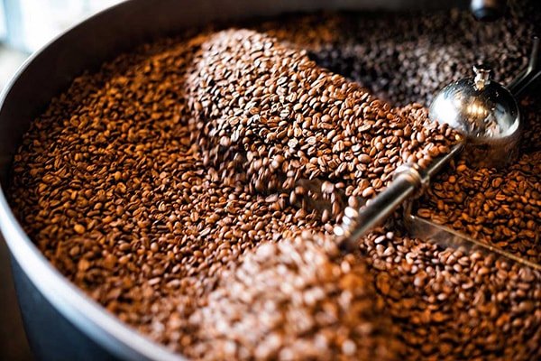 A larger photo of coffee beans roasting in a roaster, Self-Service Micro Markets