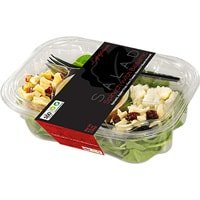 Salad with spinach and nuts in a plastic casing