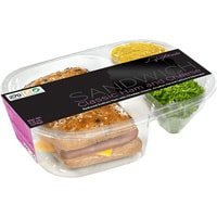 A sandwich with fixings in a plastic casing